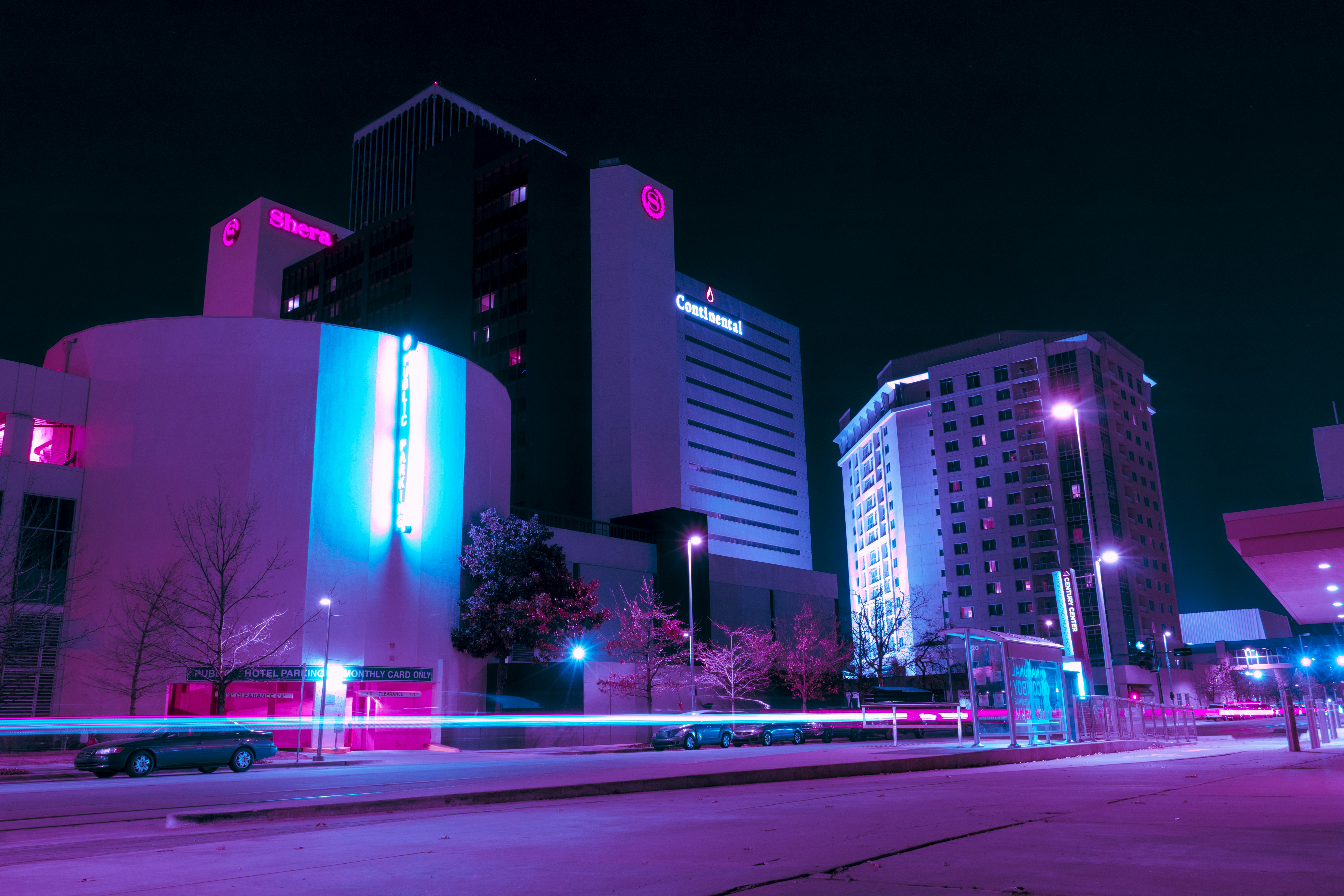 Neon Metropolis - Digital artwork featuring futuristic cityscape with vibrant neon colors and cyberpunk aesthetic