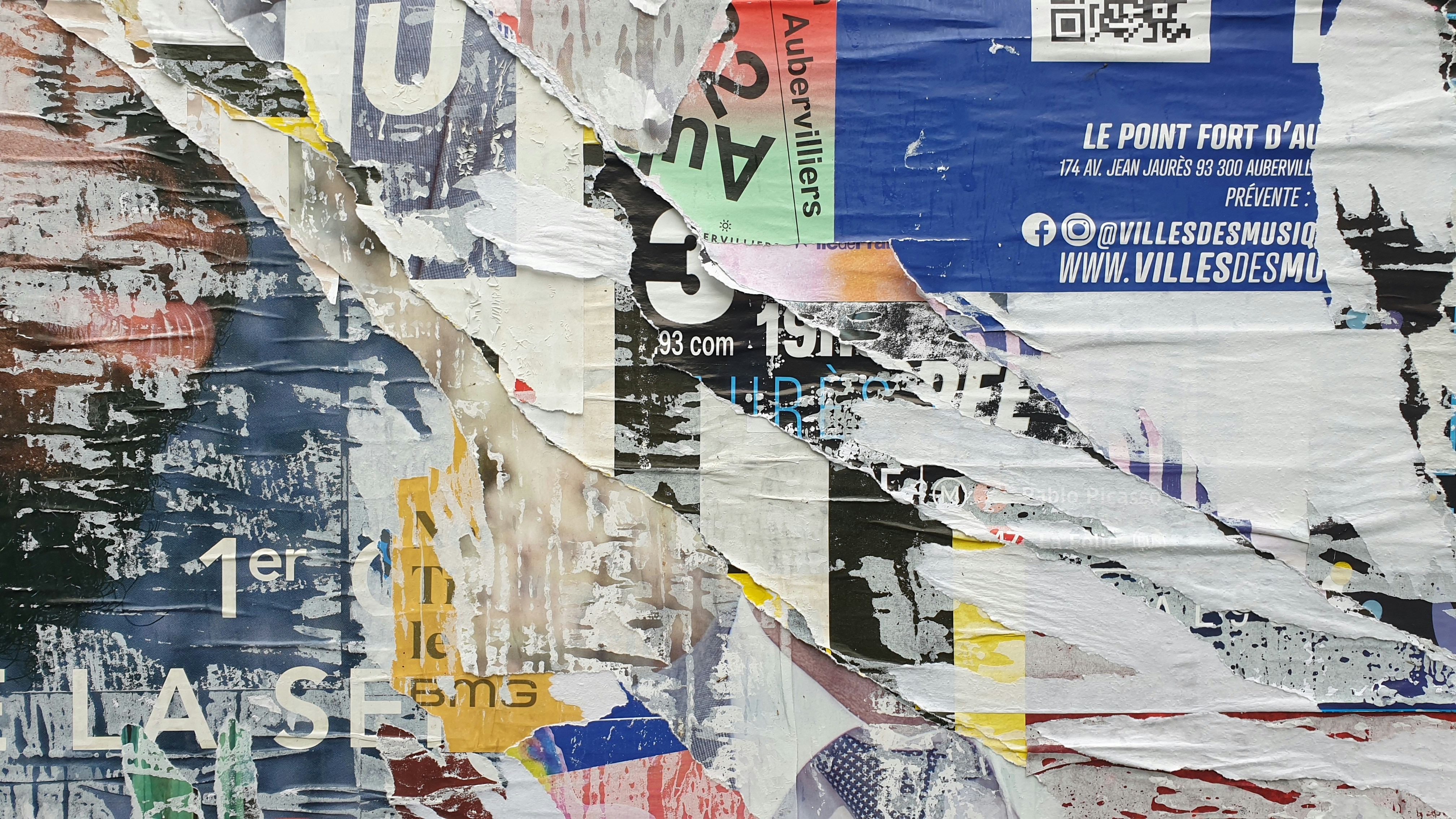 Urban Fragments - Mixed media collage incorporating newspaper, paint, and metal elements depicting city life